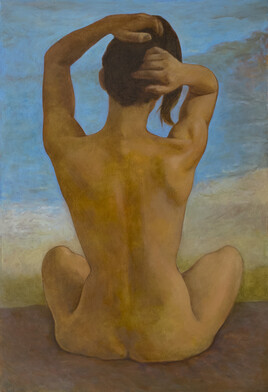 Femme nue de dos assise sur la plage