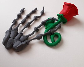 Main squelettique qui tient une rose rouge