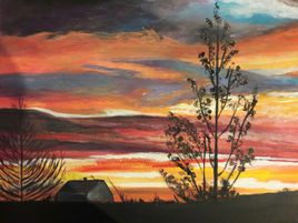 Coucher de soleil sur la campagne.